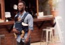 Father with a baby in a babybjorn mesh baby carrier