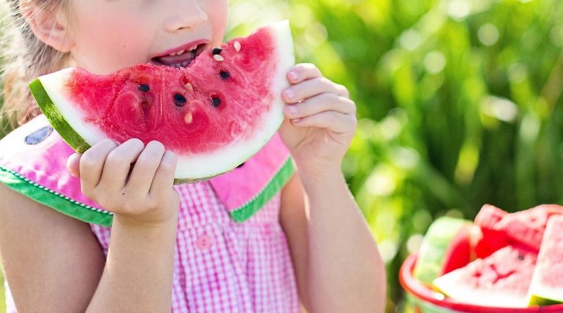 girl eating melon