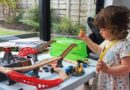 Girl playing with The Railway Bucket Builder set