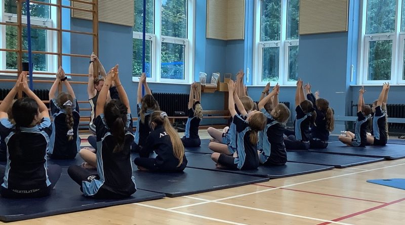 School children in yoga class