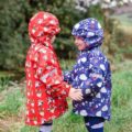 Kids under the rain in Blade and Rose Colour Changing Raincoats