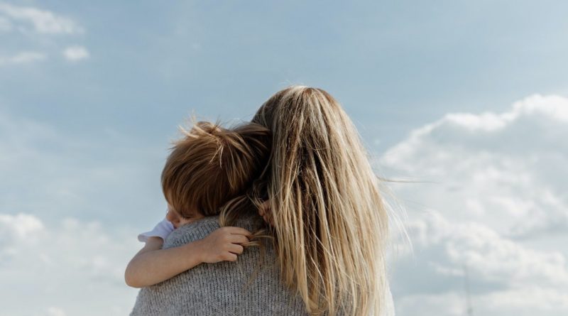 Mother hugging her child, photo by Bethany Beck at unsplush