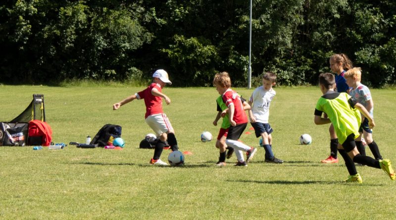 Kids playing football at Didsbury Football Club | Photo by Theo Latham