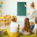 Teaching maths to kids in a small group, photo by Artem Podrez
