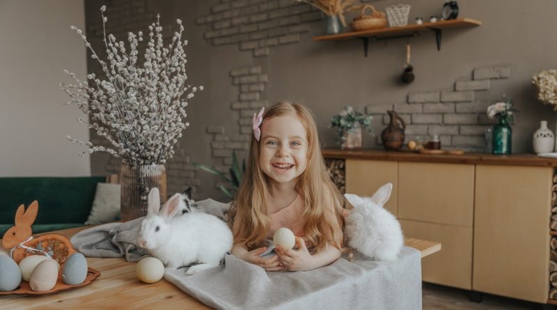 Photo by Marina Abrosimova | Girl with rabbits and Easter eggs