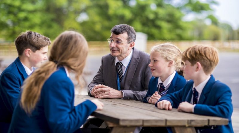 King's School, Macclesfield. Head of the school with children