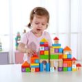 Girl playing with Tooky 70pcs rubber wood blocks set