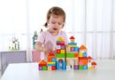 Girl playing with Tooky 70pcs rubber wood blocks set