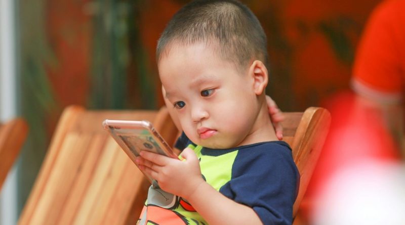 Child with smart phone