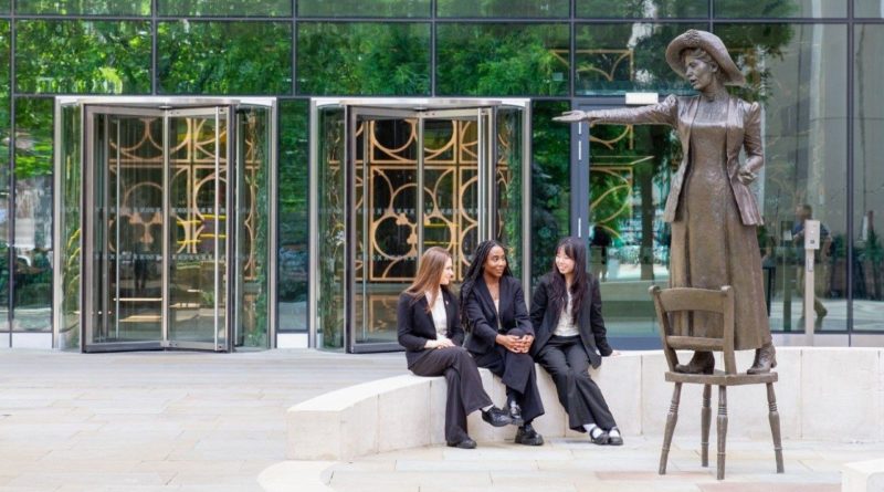 Manchester High School For Girls' pupils at the Emmeline Pankhurst Statue
