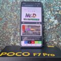 Mobile phone with M&D website on the screen