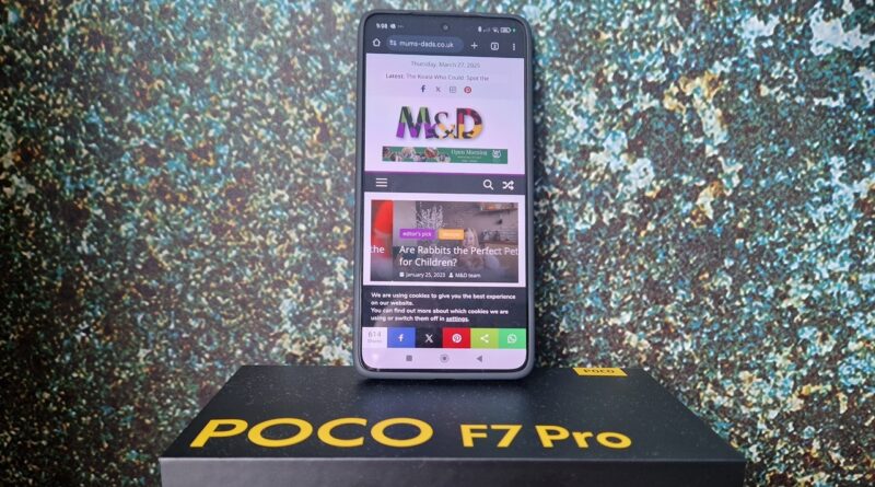 Mobile phone with M&D website on the screen