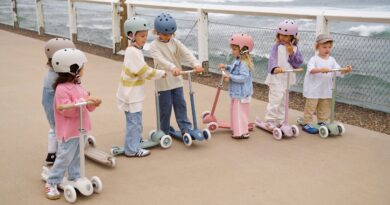 Group of children with Banwood scooters and helmets