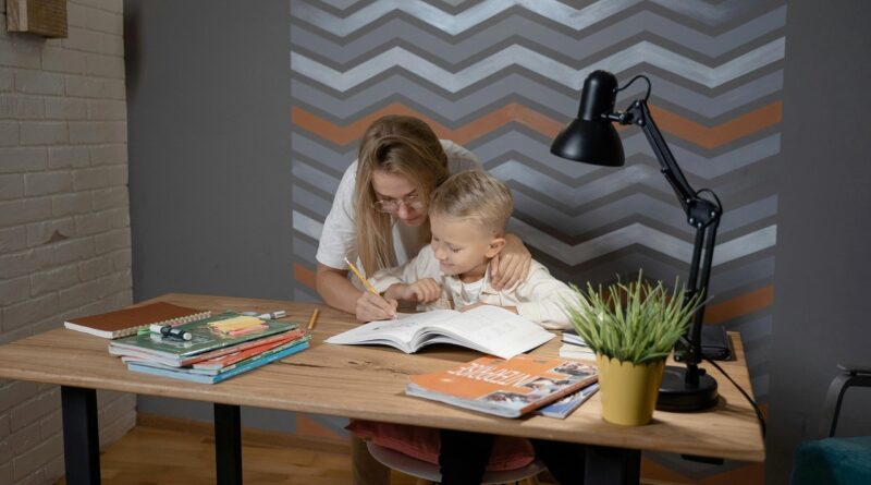 Mother teaching her son how to do his homework | Photo - pexels, Tima Miroshnichenko