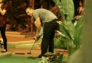 Man with son playing minigolf at Paradise Island Golf Adventure, Manchester