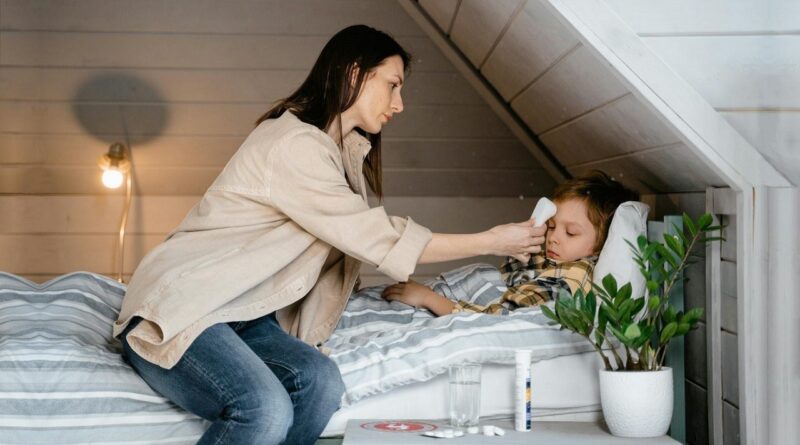 A mother caring for a sick child | Photo by mart production, pexels 7641242