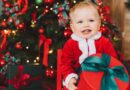 Cheeky toddler with a Christmas present