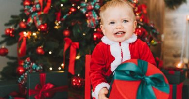 Cheeky toddler with a Christmas present