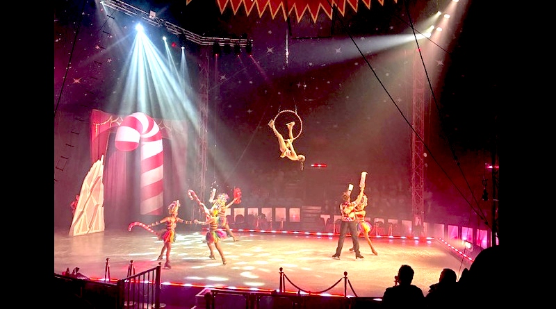 Snowstorm Ice Skating Circus | Aerialist over skating pairs