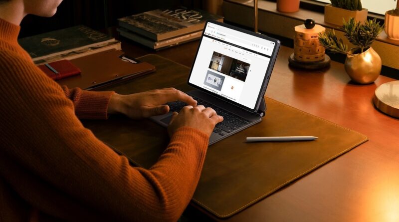 Person using Xiaomi Pad 8 Pro with the keyboard