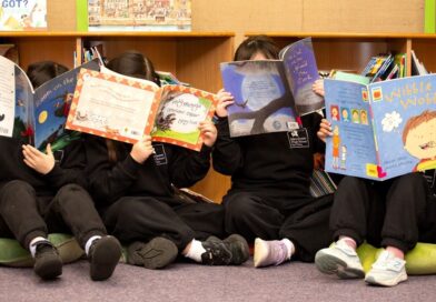 Manchester High early years pupils reading at the school's library