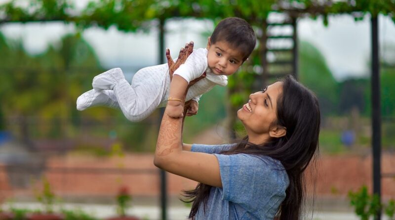 Happy mother with a baby