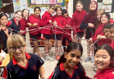 Bowdon Prep girls playing a cord game in a classroom