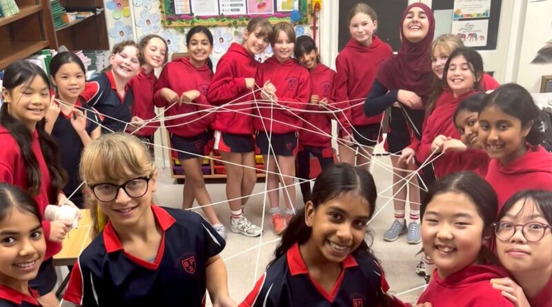 Bowdon Prep girls playing a cord game in a classroom
