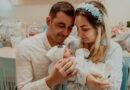 Parents looking at a newborn