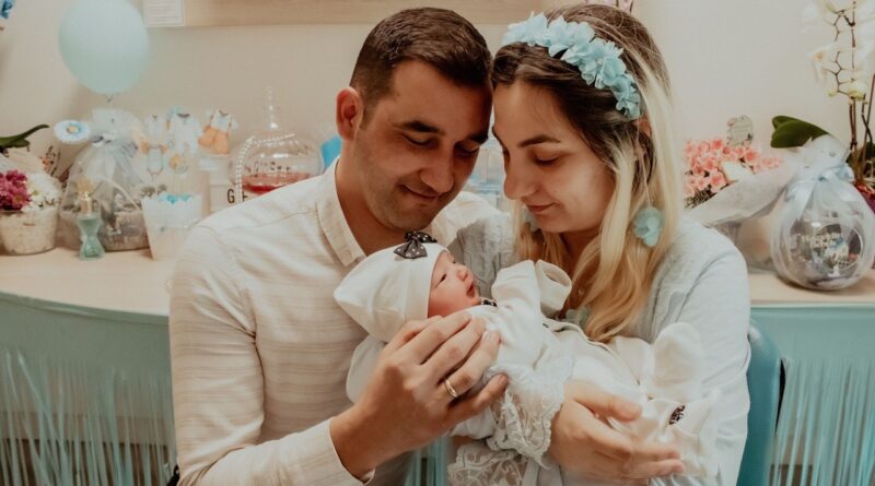 Parents looking at a newborn