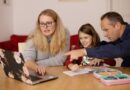 Two adults and a girl with the computor