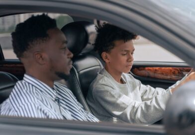 Father and son are driving a car
