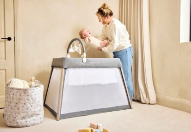 IBLI Scout 3 in 1 Travel Crib, Cot and Playpen | Mother putting a baby in the cot