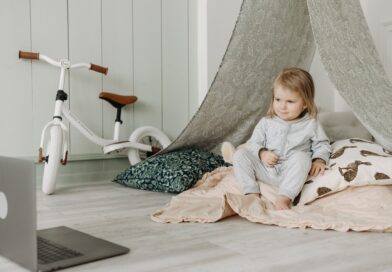 Little girl, computer and bicycle