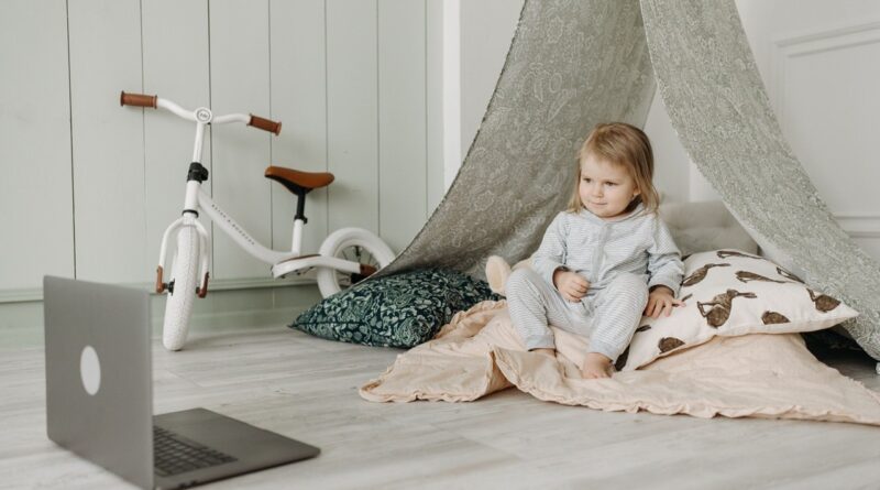 Little girl, computer and bicycle